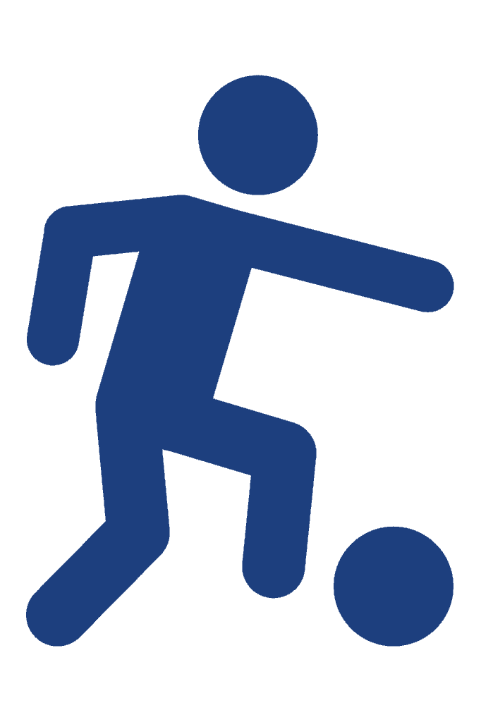 Young football player kicking a ball at Bishop Auckland FC.