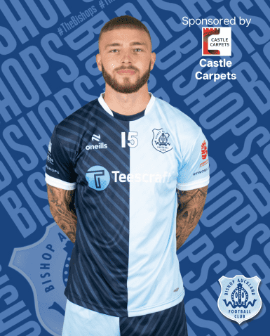 Bishop Auckland FC player wearing the club's blue and white kit, showcasing team pride and local football excellence in County Durham.