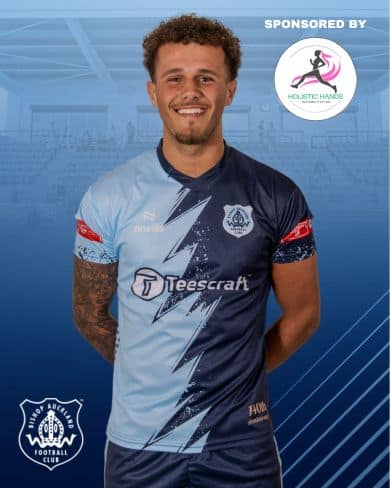 Athletic Bishop Auckland FC player wearing team jersey, promoting local football team, sponsorship, and sports community involvement in the UK football scene.