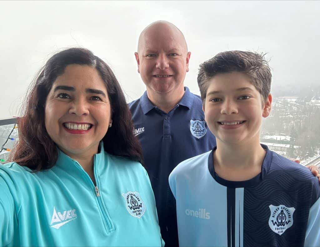 Bright and cheerful group photo of Bishop Auckland FC staff and player, showcasing the team’s vibrant spirit and club pride at the iconic football club's location in Bishop Auckland.