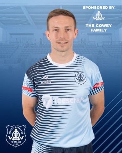 Match-day football player portrait in Bishop Auckland FC kit, showcasing team pride and club branding.