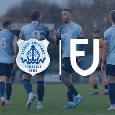 Players shaking hands after a match at Bishop Auckland Football Club, showcasing team spirit and camaraderie in non-league football.