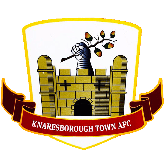 Official badge of Knaresborough Town AFC featuring a castle tower and a hand holding an olive branch, symbolising strength and peace.